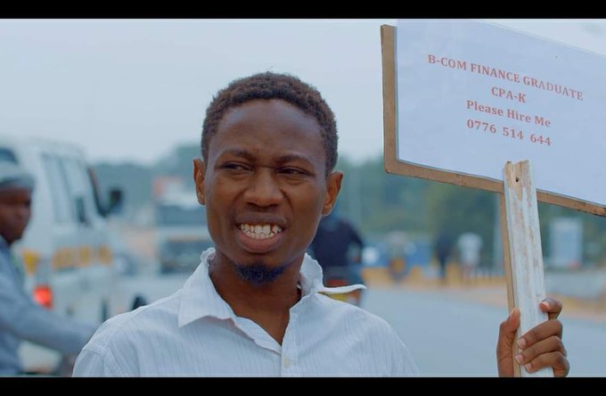 KENYAN ARTISTE KASH BIRO TAKES TO THE STREET WITH A PLACARD IN A JOB HUNTING MISSION.