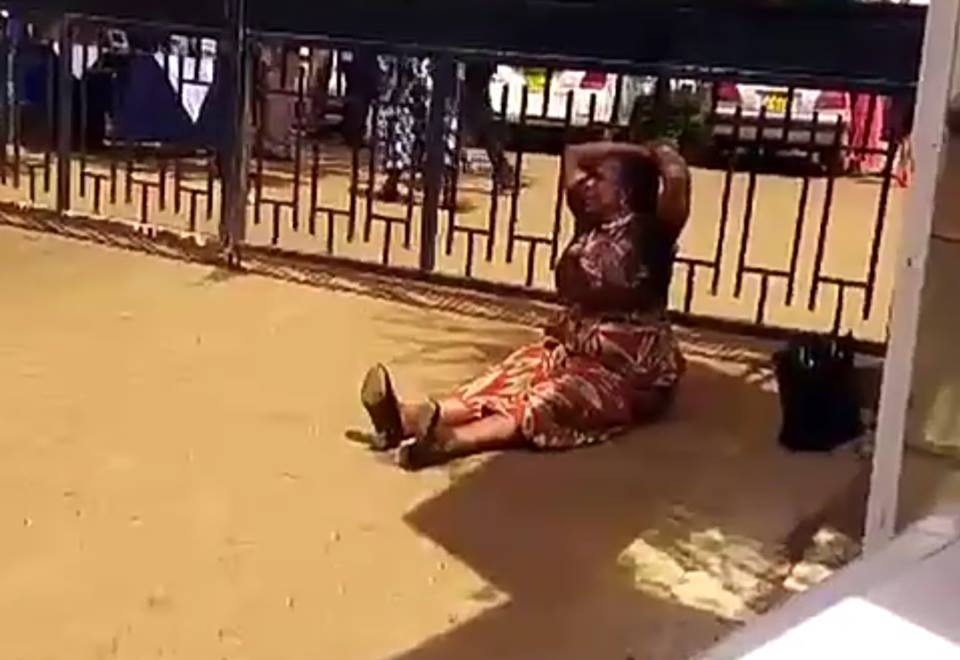 Woman cries and throws herself to the ground after she was kicked out by governor for taking pictures with President Uhuru (Video)