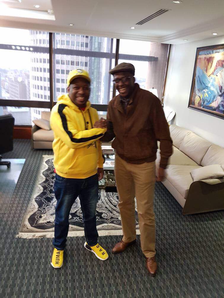 Mike Sonko rocking his expensive shoes and a matching hoodie