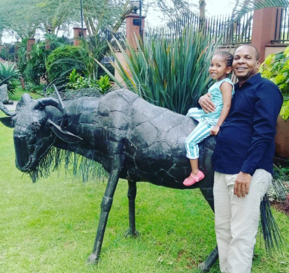 Danson Mungatana having fun with their youngest daughter