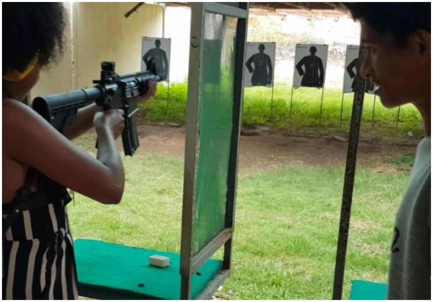 Anita Nderu and her boyfriend enjoy shooting fully automatic assault rifle in Thailand