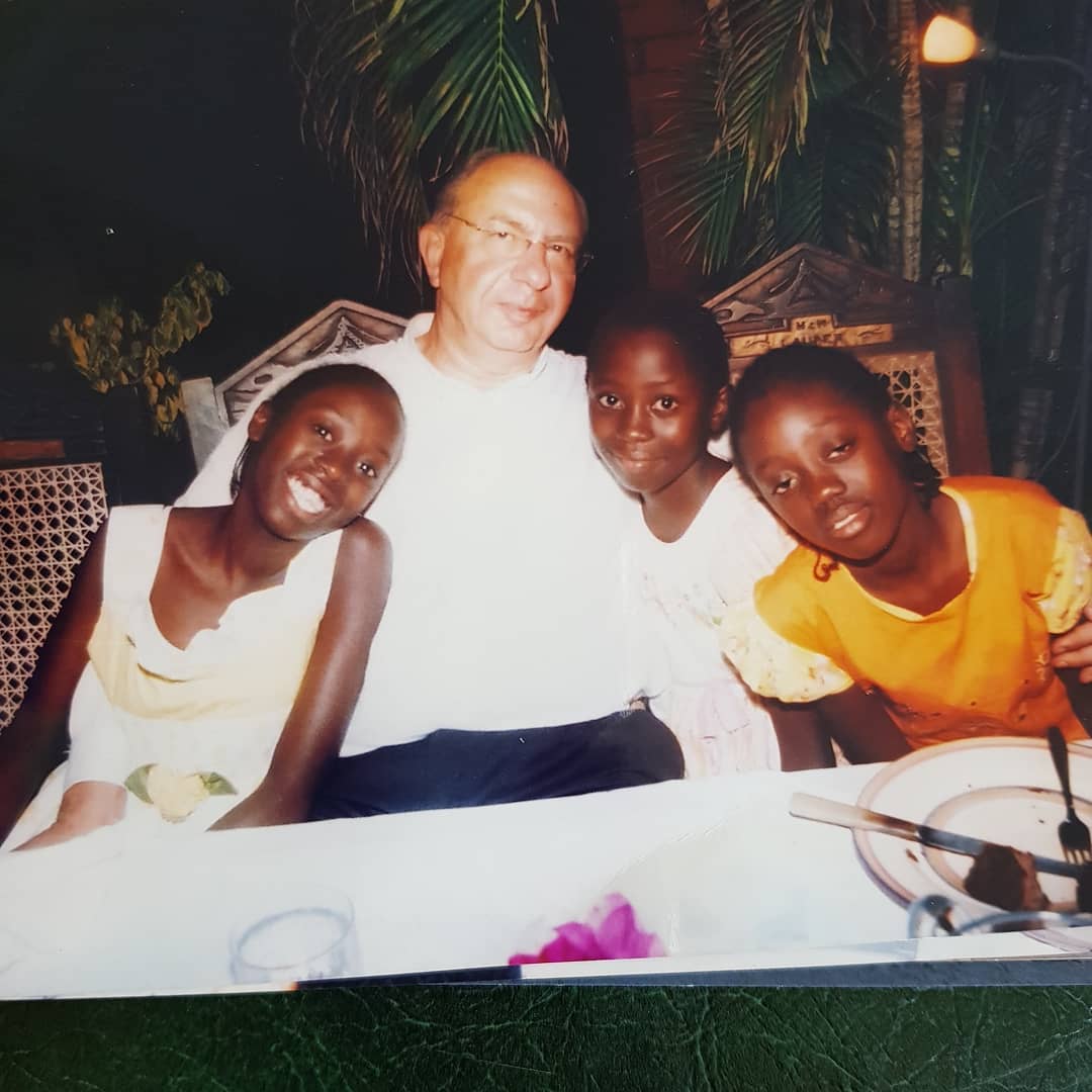 Oyoo's father with Akothee's daughters in an old photo