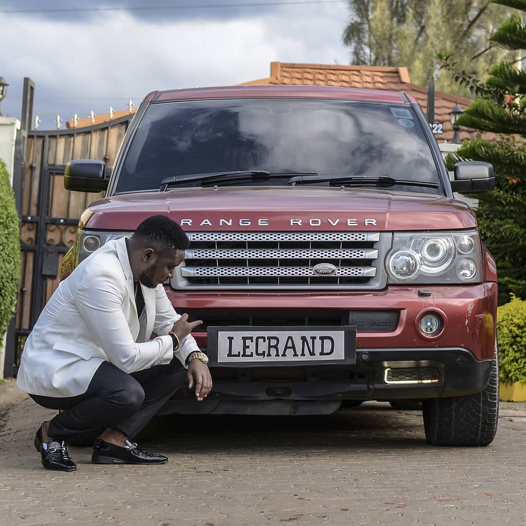 Pitson points at the Range Rover's customized plate which bares his other alias 'LeGrand'. 
