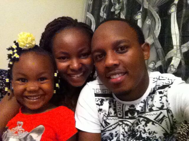 Abel Mutua with his wife and daughter 
