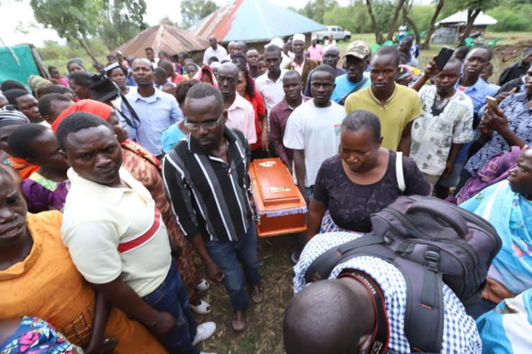 Mourners carry the casket bearing the remains of Sharon Otieno's baby 