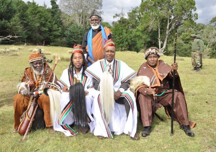 Qadree El-Amin (second on right) and Prince Michael (third on right) after being inducted into the Gikuyu community 