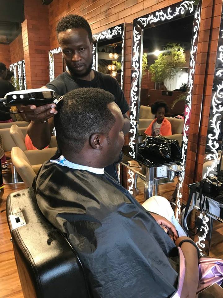 Nick Odhiambo getting a haircut at Posh Palace 