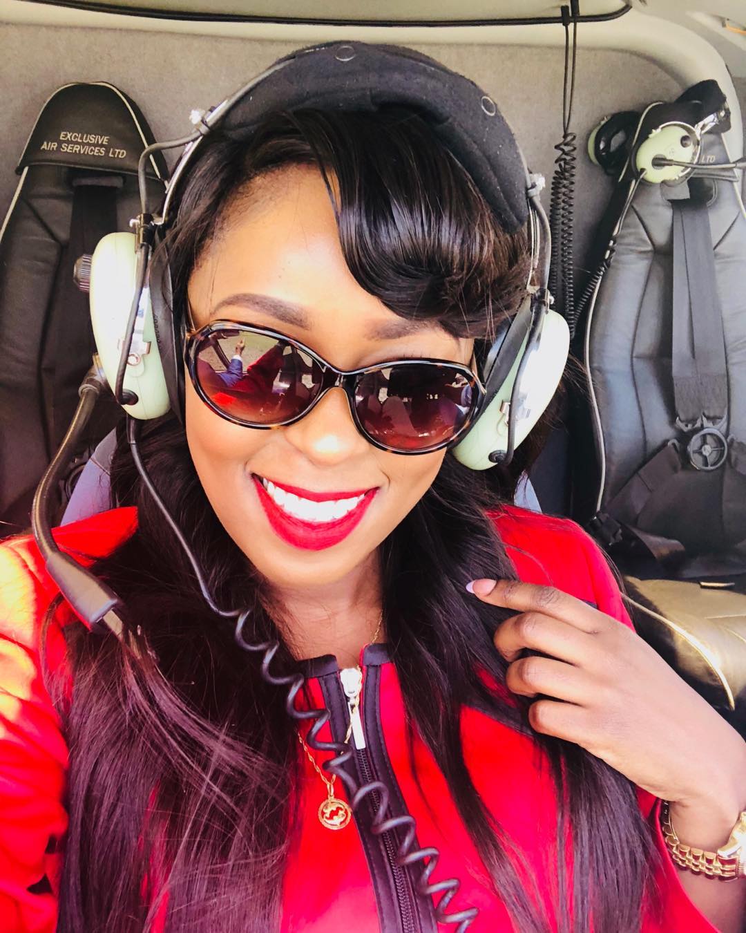 Lillian Muli takes a selfie in the chopper during her trip to Kisii