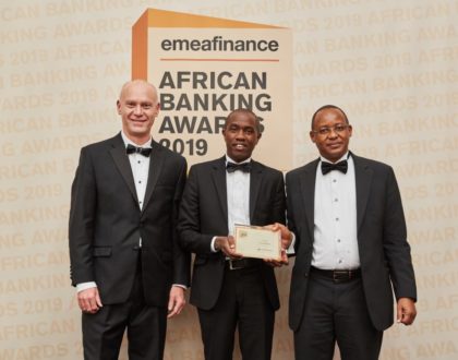 (L-R) The Publisher and CEO EMEA Finance Christopher Moore grants the Best Bank in Kenya 2019 Award to Co-op Bank Economist Anthony Muli and Head of Investor Relations and Strategy James Kaburu at the EMEA Awards gala