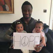 Cute photo of Mikel Obi and his twin daughters