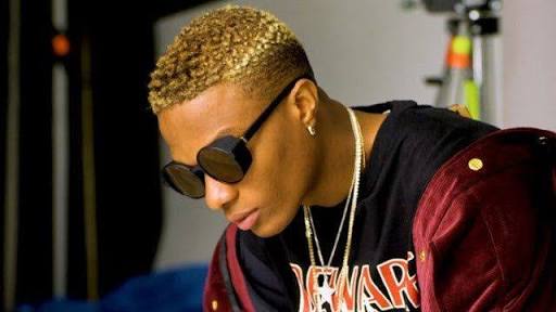 Wizkid Performs at a Show with a Face Mask