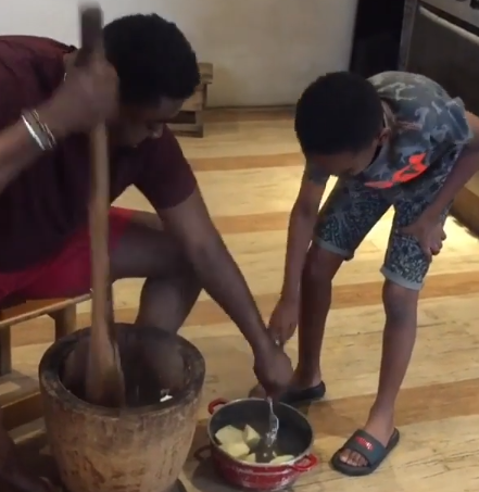 Kunle Afolayan is such a super dad, he teaches his son how to pound yam