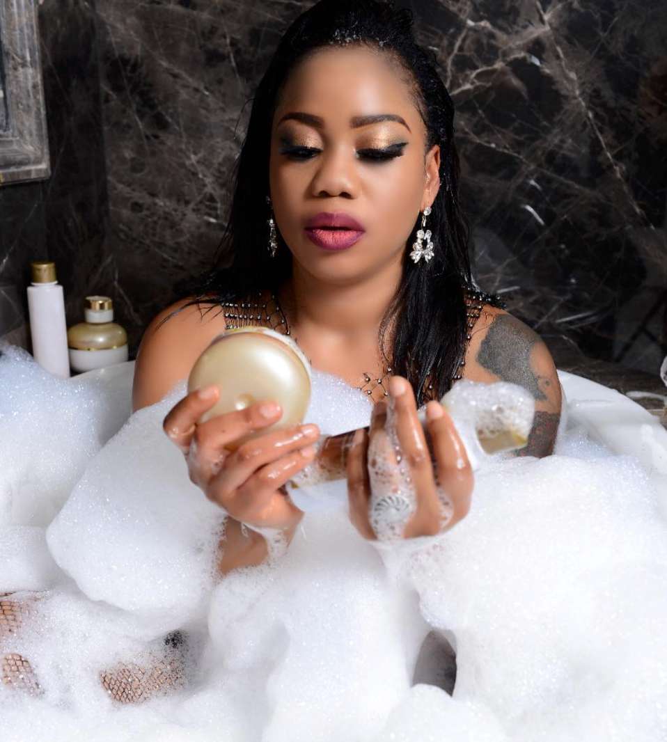 Toyin Lawani Flashes her Boobs in Bathtub Photos