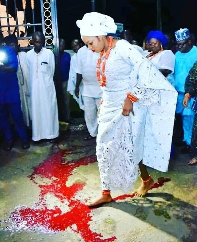 New photo showing Ooni of Ife’s new wife Prophetess Naomi crossing a spill of blood