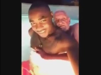Caught on tape: Disturbing video of a handsome young man caressing old gay mzungu sponsor in a swimming pool